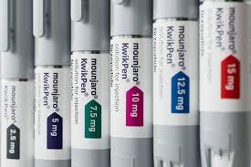 PPRX  Row of medicine vials on a shelf with dosage labels like 75 mg and 10 mg, showing a pharmacy or storage setting.